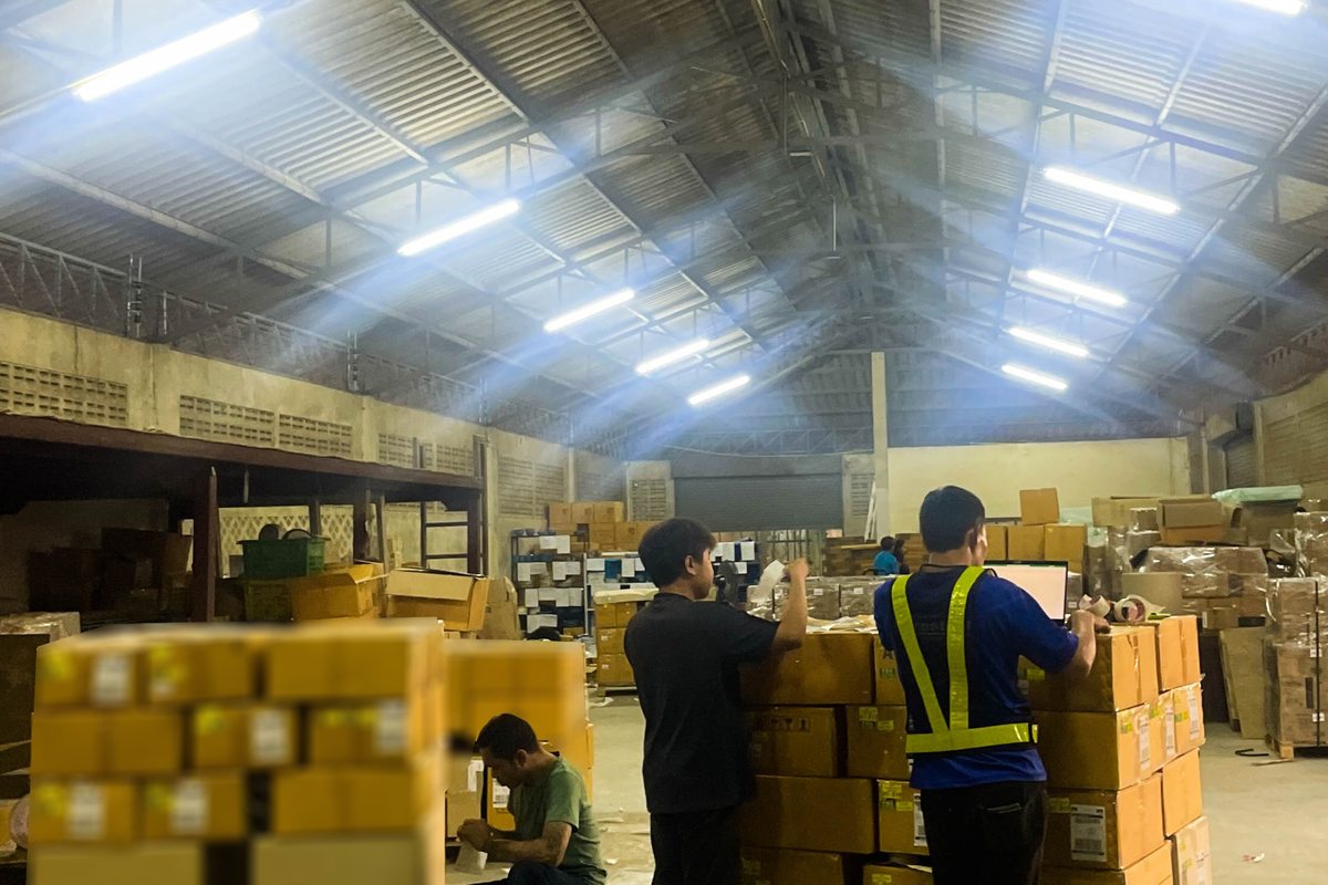 Forklift driver staging heavy palletized freight for linehaul loading