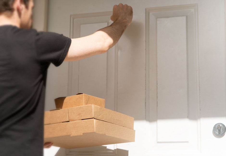 Express courier delivering urgent package directly to recipient door