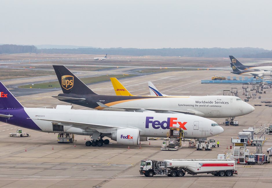 Air cargo freighters handling international courier parcel batches